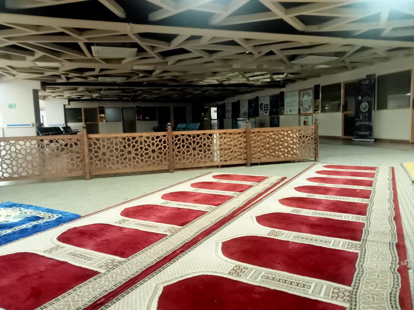 Prayer hall with lattice ceiling and timber jaali screens